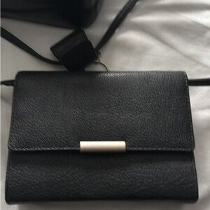 Elegant Black Crossbody Bag with White Accent